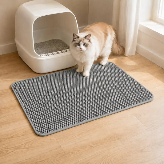 Gray XL double-layer cat litter mat beside a white litter box with a fluffy cat